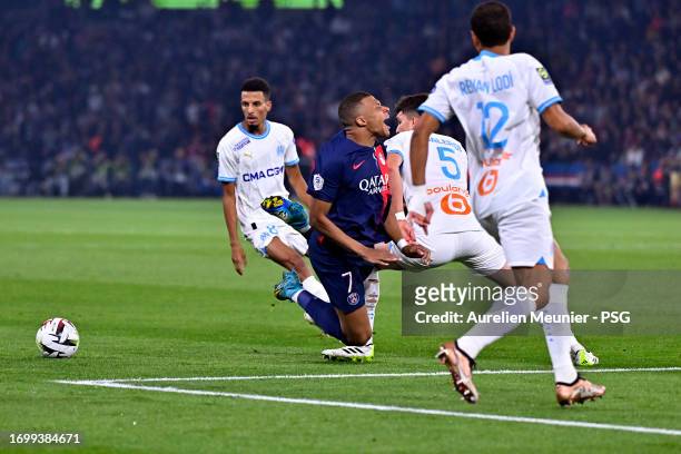 Kylian Mbappe of Paris Saint-Germain injures his ankle during the Ligue 1 Uber Eats match between Paris Saint-Germain and Olympique de Marseille at...