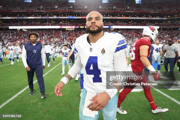 Dak Prescott of the Dallas Cowboys on the field following a loss against the Arizona Cardinals at State Farm Stadium on September 24, 2023 in...