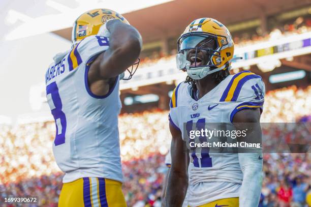 Wide receiver Brian Thomas Jr. #11 of the LSU Tigers celebrates with wide receiver Malik Nabers of the LSU Tigers after scoring a touchdown during...