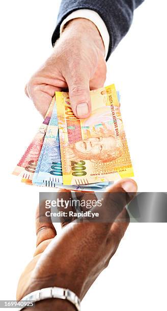 south african mandela banknotes being passed to male hand - south african currency stock pictures, royalty-free photos & images