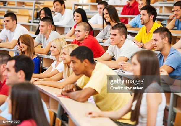 large group of students at university amphitheatre. - large auditorium stock pictures, royalty-free photos & images