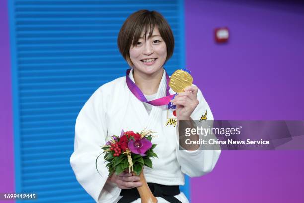 Gold medalist Tsunoda Natsumi of Team Japan poses during the medal ceremony for the Judo - Women's 48Kg Final Final on day one of the 19th Asian...