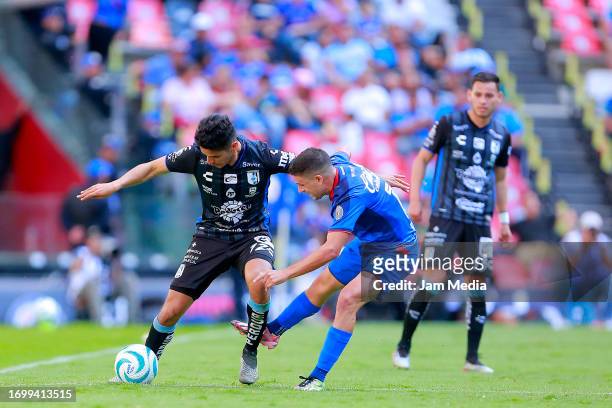 Jaime Gomez of Queretaro fights for the ball with Jose Rivero of Cruz Azul during the 9th round match between Cruz Azul and Queretaro as part of the...