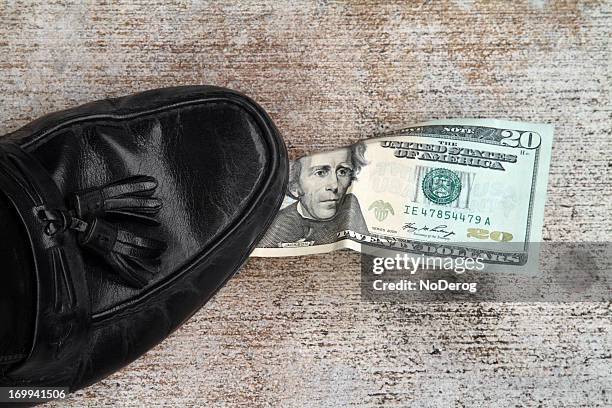 shoe snags wind blown 20 bill against sidewalk - twenty us dollar note stock pictures, royalty-free photos & images