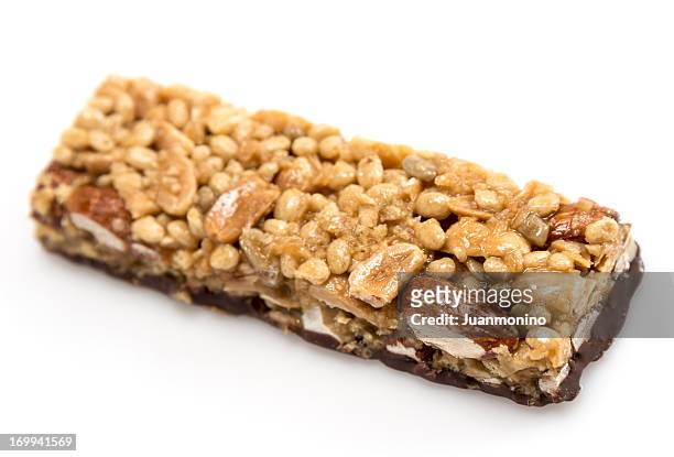 chocolate, almonds, and peanuts energy bar - almonds isolated stock pictures, royalty-free photos & images