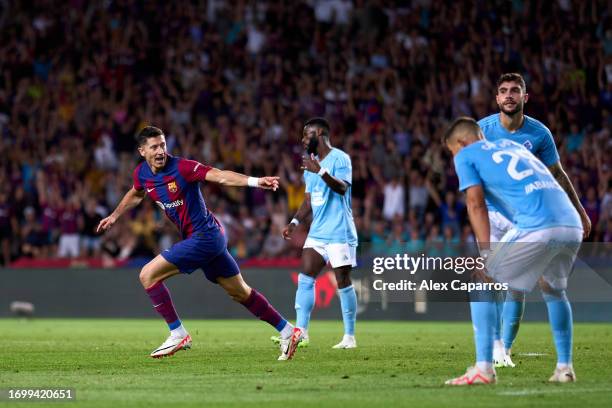 Robert Lewandowski of FC Barcelona celebrates after scoring his team's second goal during the LaLiga EA Sports match between FC Barcelona and RC...