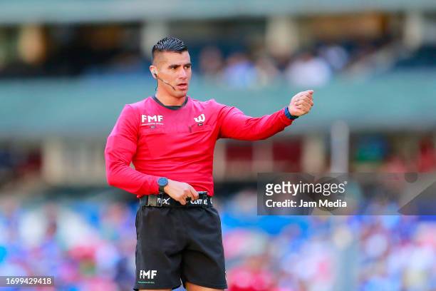 Abraham de Jesus Quirarte, Central referee, gestures during the 9th round match between Cruz Azul and Queretaro as part of the Torneo Apertura 2023...