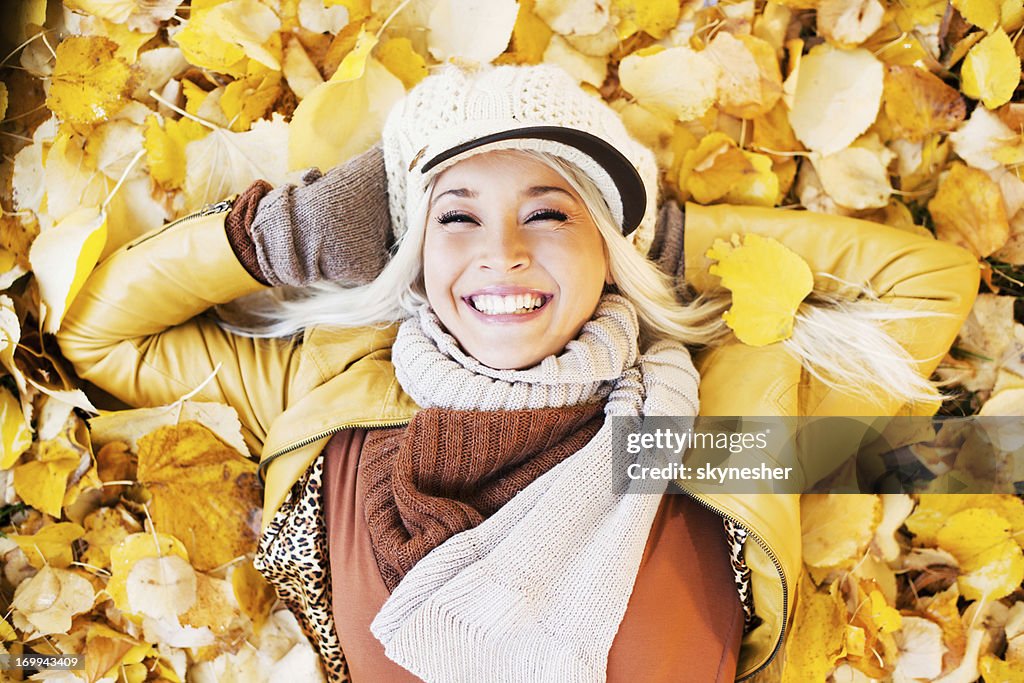 Beautiful woman enjoying in a sunny autumn day