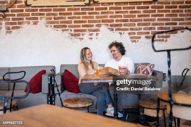 friends in cafe, sharing moments. - generation x stock pictures, royalty-free photos & images