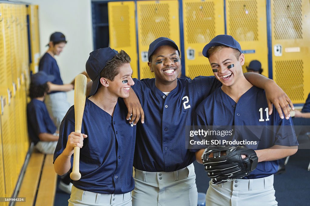 High school teammates in locker room after baseball game