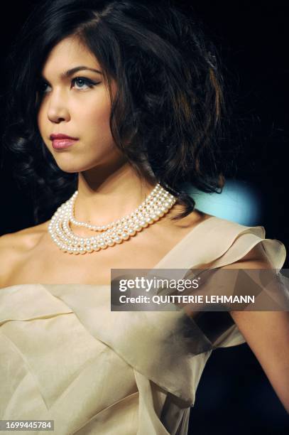 Model presents a creation entitled 'Curves of Life' by Freda Wang as part of an MA Graduation Fashion Show 2010 by the Hong Kong Polytechnic...