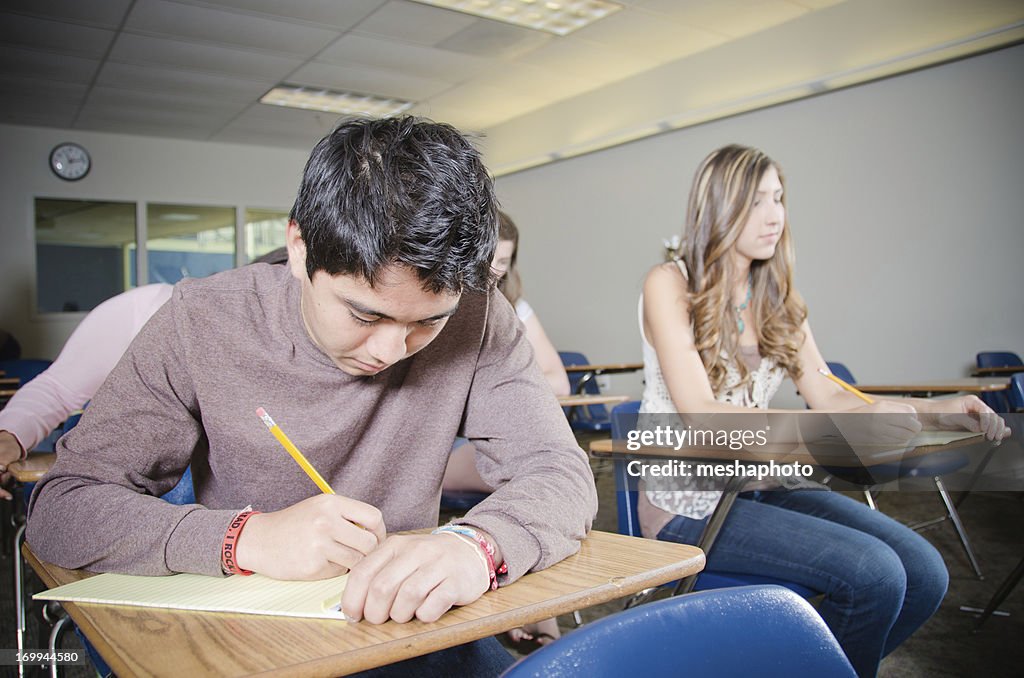 Students in Classrom Learning and Writing