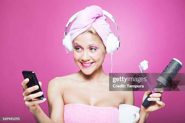 morning bathroom multitasking. - womens indoor cup 2013 stock pictures, royalty-free photos & images