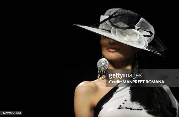 Model displays a creation by Indian designer Ritu Beri during the Wills India Fashion Week Spring Summer 2010 in New Delhi on October 24, 2009. The...