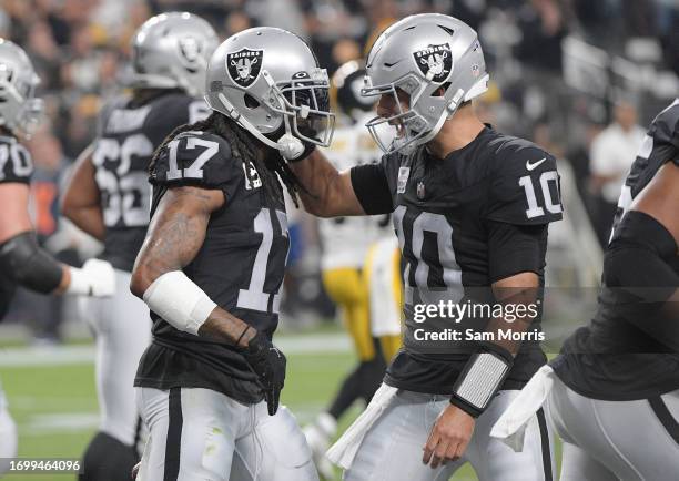 Davante Adams of the Las Vegas Raiders celebrates a touchdown with Jimmy Garoppolo during the first quarter in the game against the Pittsburgh...