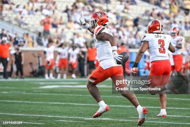 Bowling Green cornerback Jordan Oladokun waves to the crowd after intercepting a pass during the college football game between the Bowling Green...