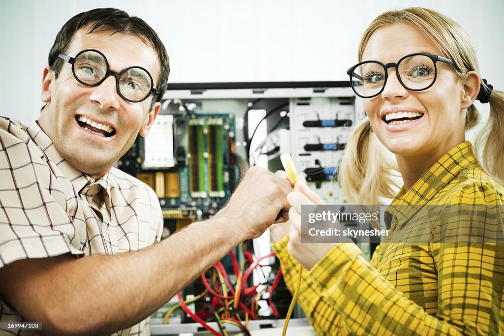 Two Geeks Fixing A Computer High-Res Stock Photo - Getty Images