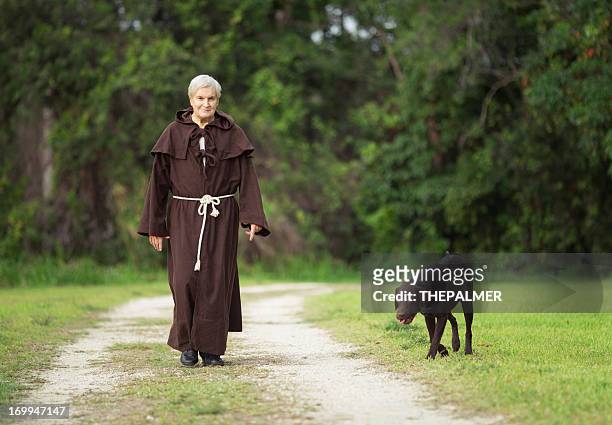 monk and his dog - monk religious occupation stock pictures, royalty-free photos & images