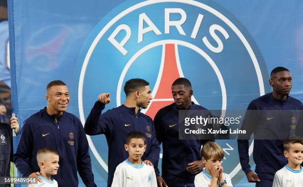 Kylian Mbappe, Achraf Hakimi, Ousmane Dembele and Rand Kolo Muani of Paris Saint-Germain pose before the Ligue 1 Uber Eats match between Paris...