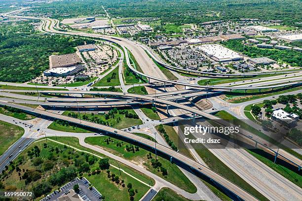 highway overpass intersection and shopping center in austin texas - austin texas aerial stock pictures, royalty-free photos & images