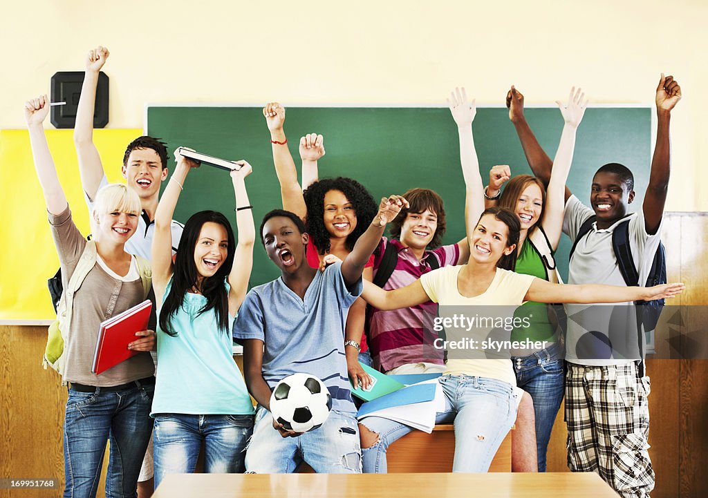 Group of cheerful students looking at the camera