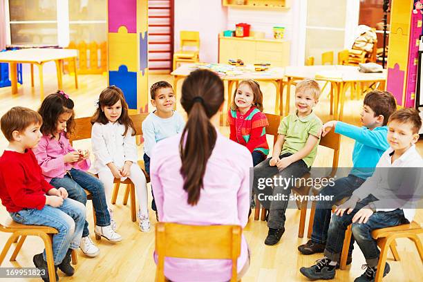 kids with kindergarten teacher. - teacher in front of class stock pictures, royalty-free photos & images