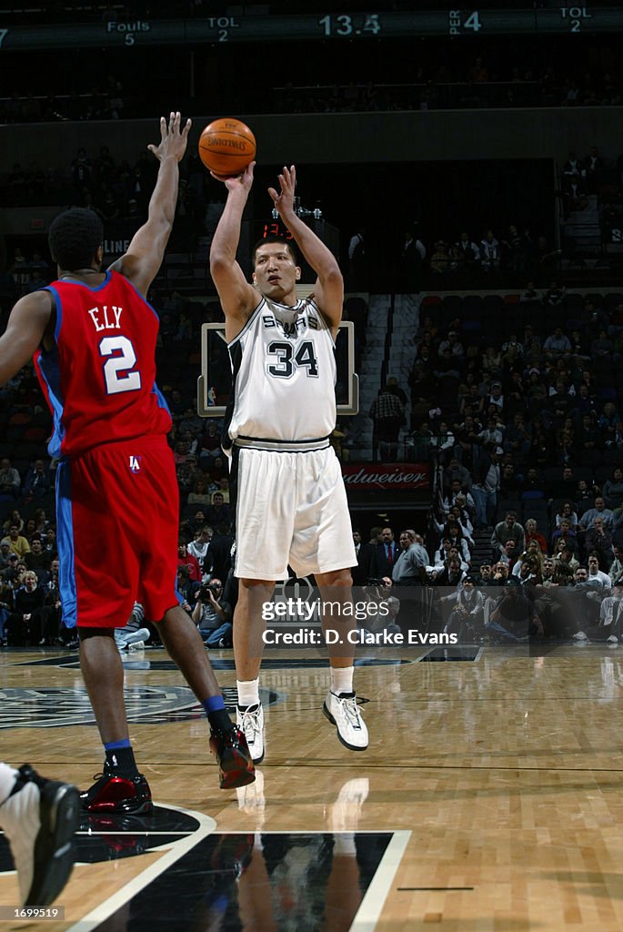 Mengke Center Mengke Bateer of the San Antonio Spurs shoots a jump shot over ...