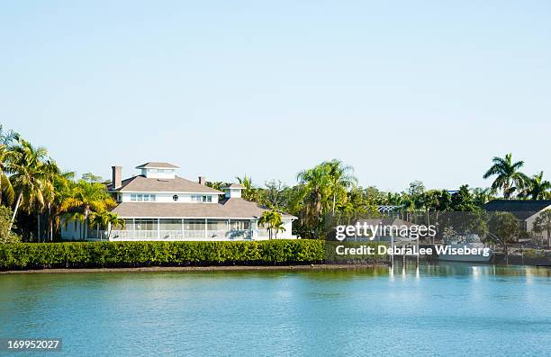 living along the canal - naples pier stock pictures, royalty-free photos & images