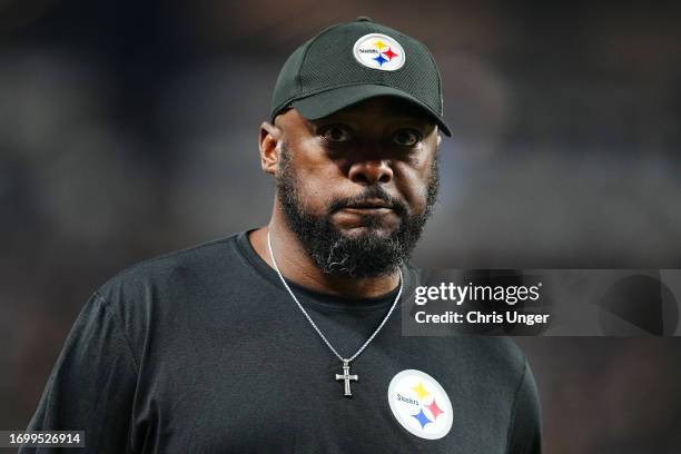 Head coach Mike Tomlin of the Pittsburgh Steelers walks off the field at halftime in the game against the Las Vegas Raiders at the end of the second...