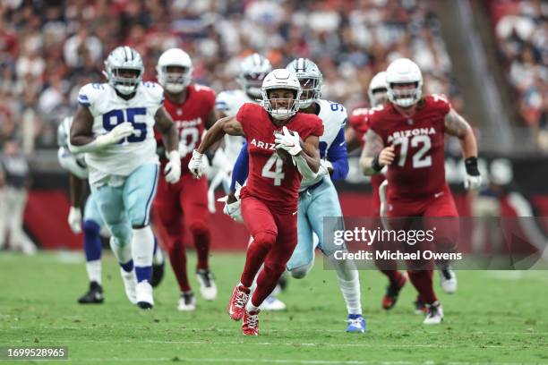 Rondale Moore of the Arizona Cardinals runs with the ball for a touchdown during an NFL football game between the Arizona Cardinals and the Dallas...
