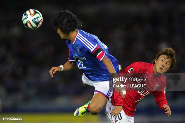 Yuji Nakazawa of Yokohama F.Marinos and Tadanari Lee of Urawa Red Diamonds compete for the ball during the J.League J1 match between Yokohama...