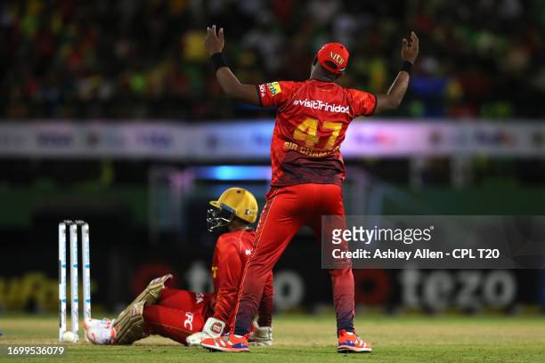 Dwayne Bravo and Nicholas Pooran of Trinbago Knight Riders react to a missed chance during the Republic Bank Caribbean Premier League Final between...