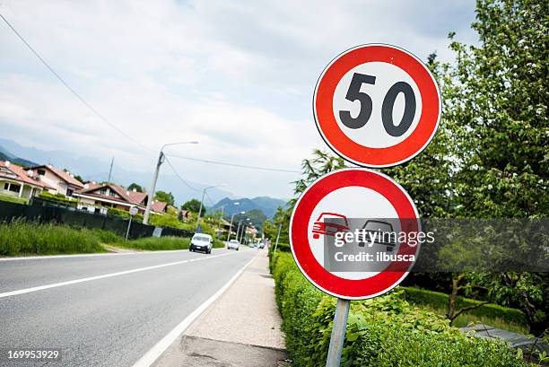 speed limit 50 and  no overtaking italian roadsign - speed limit sign stock pictures, royalty-free photos & images