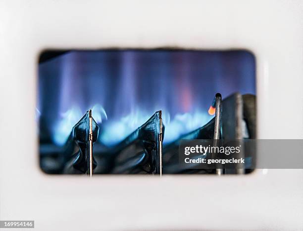 gas boiler flame close-up - home furnace stock pictures, royalty-free photos & images