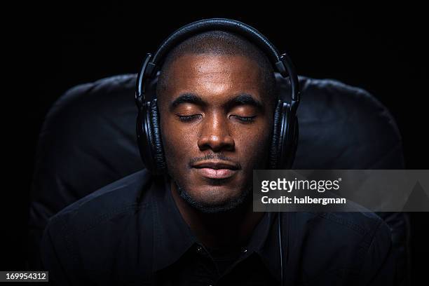 relaxed man listening to music - portrait zen stock pictures, royalty-free photos & images