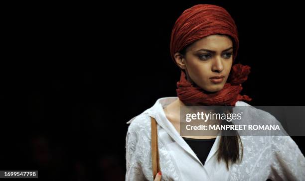 Model presents a creation by Indian designer Meera and Muzaffar Ali during the Wills India Fashion Week Spring Summer 2010 in New Delhi on October...