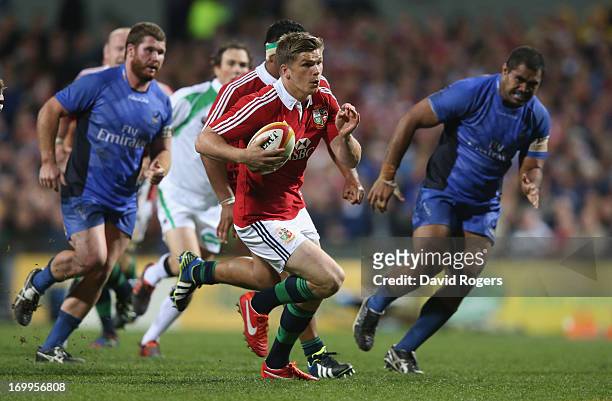 Owen Farrell of the Lions breaks clear to score a try during the tour match between the Western Force and the British & Irish Lions at Patersons...