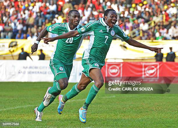 Nigeria's Ahmed Musa and Sunday Mba celebrate after Musa scored to make it 1-0 during their 2014 World Cup Qualifying match against Kenya at Kasarani...