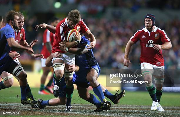 Geoff Parling of the Lions is tackled during the tour match between the Western Force and the British & Irish Lions at Patersons Stadium on June 5,...