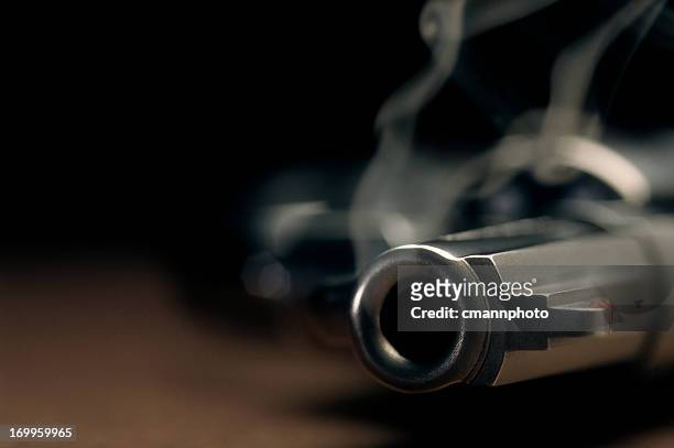smoking gun lying on the floor, revolver - pistol stock pictures, royalty-free photos & images