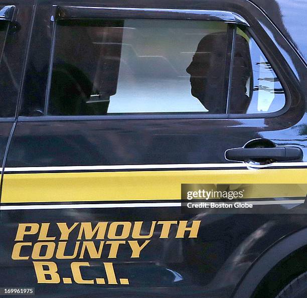 In the backseat of a Plymouth County Sheriff vehicle, James "Whitey" Bulger arrives at the John Joseph Moakley United States Courthouse on June 5,...