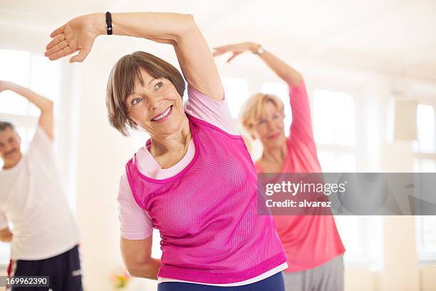 group of senios in the yoga studio - aerobic stockfoto's en -beelden