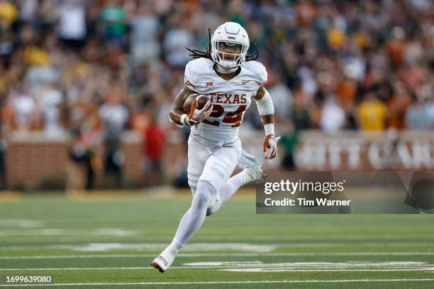 Jonathon Brooks of the Texas Longhorns rushes for a touchdown in the first quarter against the Baylor Bears at McLane Stadium on September 23, 2023...