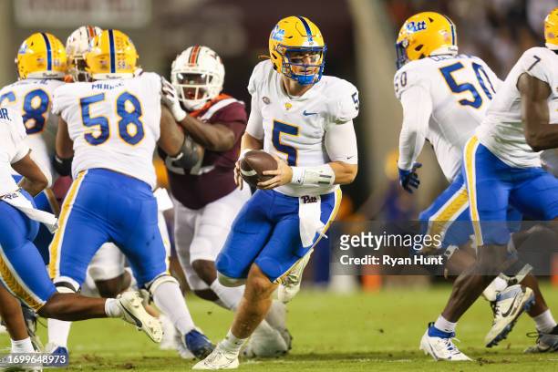 Phil Jurkovec of the Pittsburgh Panthers looks to run the ball against the Virginia Tech Hokies in the first half during a game at Lane Stadium on...