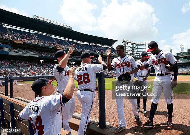 Julio Teheran of the Atlanta Braves celebrates with teammates after the eighth inning against the Pittsburgh Pirates at Turner Field on June 5, 2013...