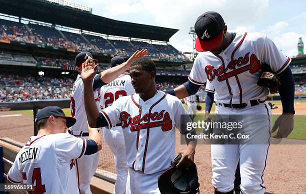 Julio Teheran of the Atlanta Braves celebrates with teammates after the eighth inning against the Pittsburgh Pirates at Turner Field on June 5, 2013...