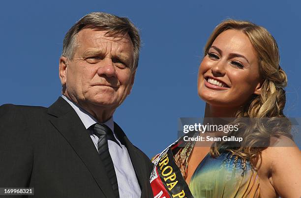 Hartmut Mehdorn, Chairman of Berlin Brandenburg International Airport, and former Miss Germany Anne Julia Hagen attend the christening of a new...