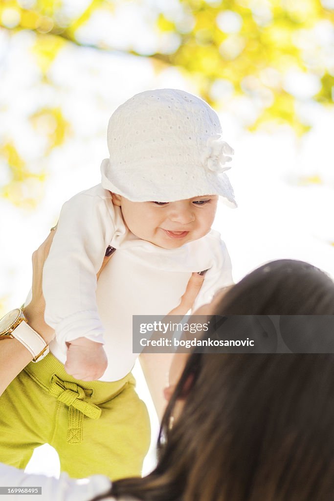 Mother playing with baby