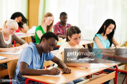 Student Using Notebook Paper Students Writing In Their Notebooks High-Res Stock Photo - Getty Images