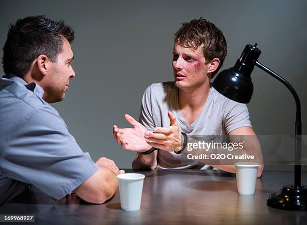 police interrogation - police station stock pictures, royalty-free photos & images